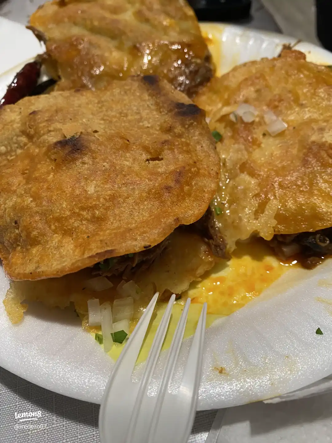 A plate of food with a fork on it.